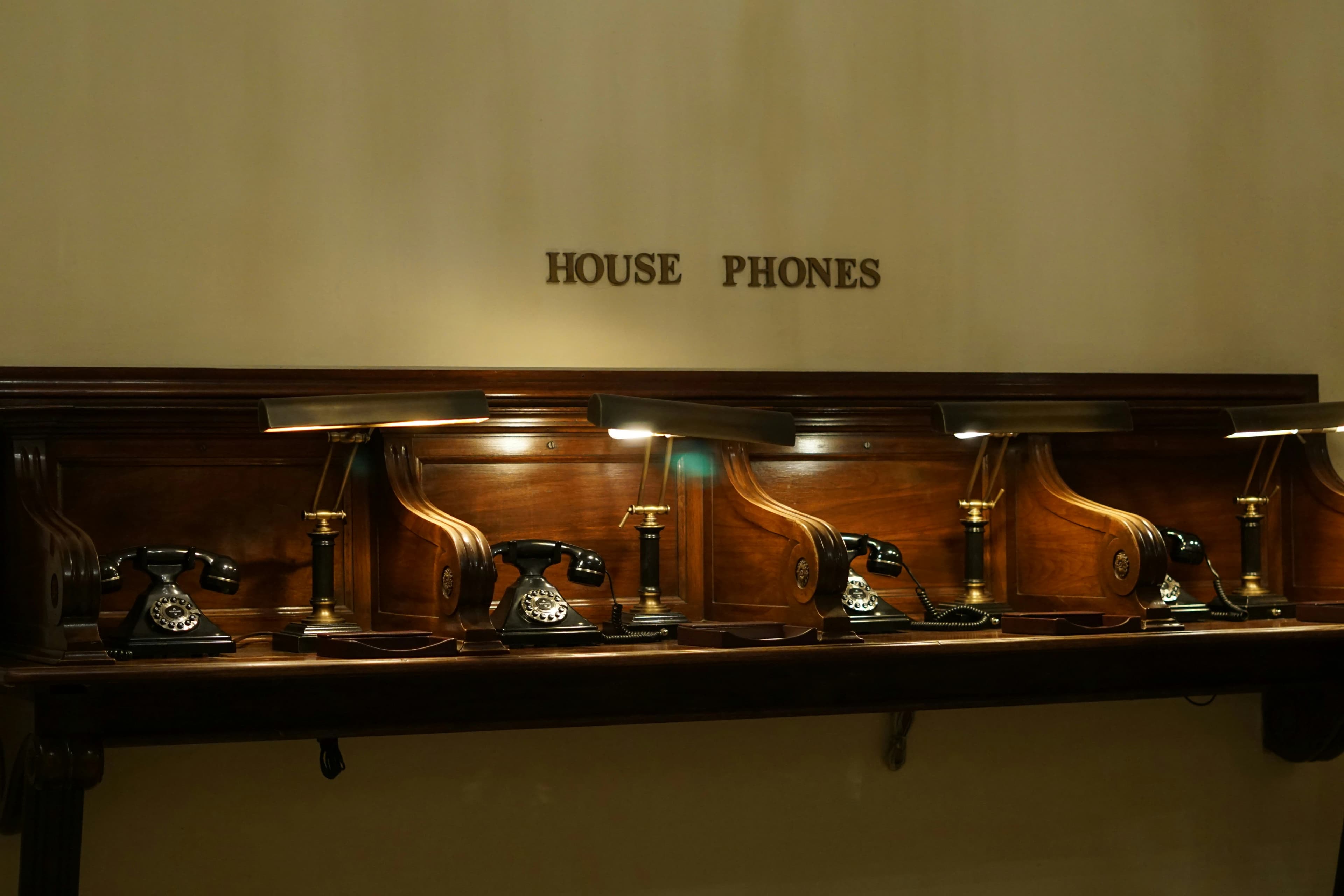 Row of house phones arranged along a wall
