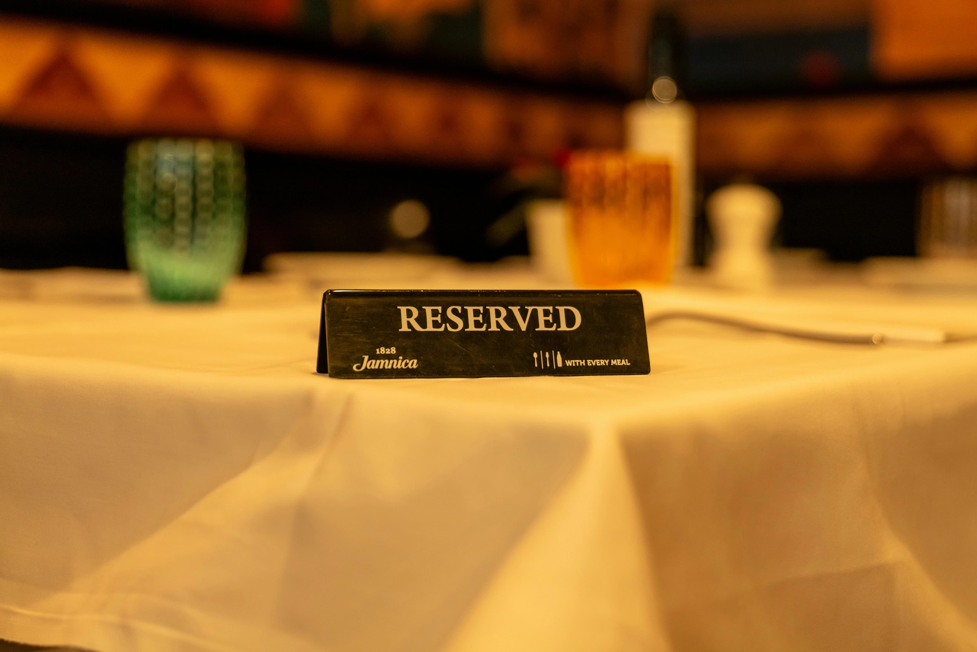Reserved table marker placed on a set dining table