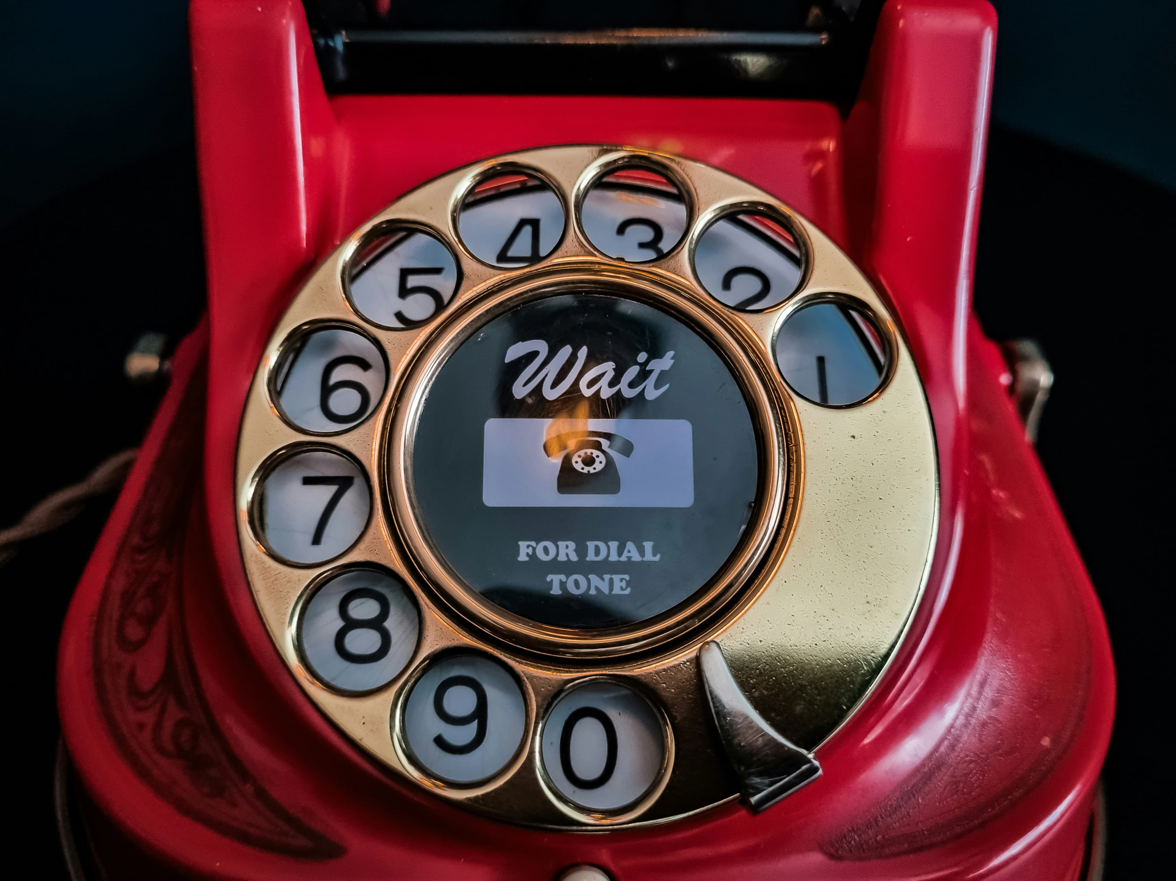 Close-up of a desk phone at a restaurant host stand signaling unanswered call demand
